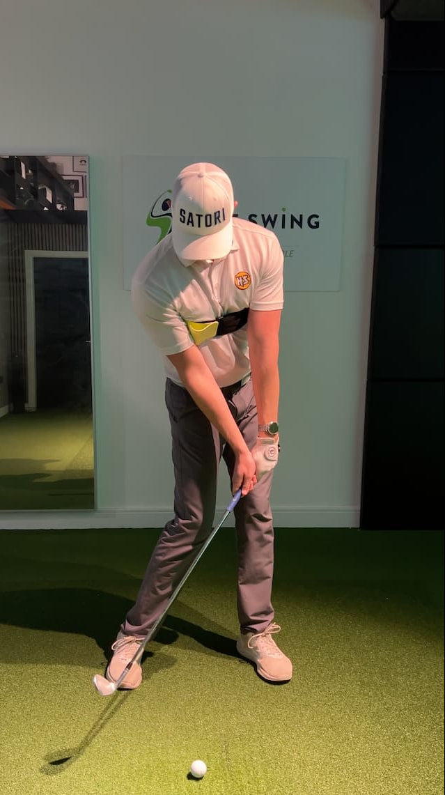 Person training golf shot